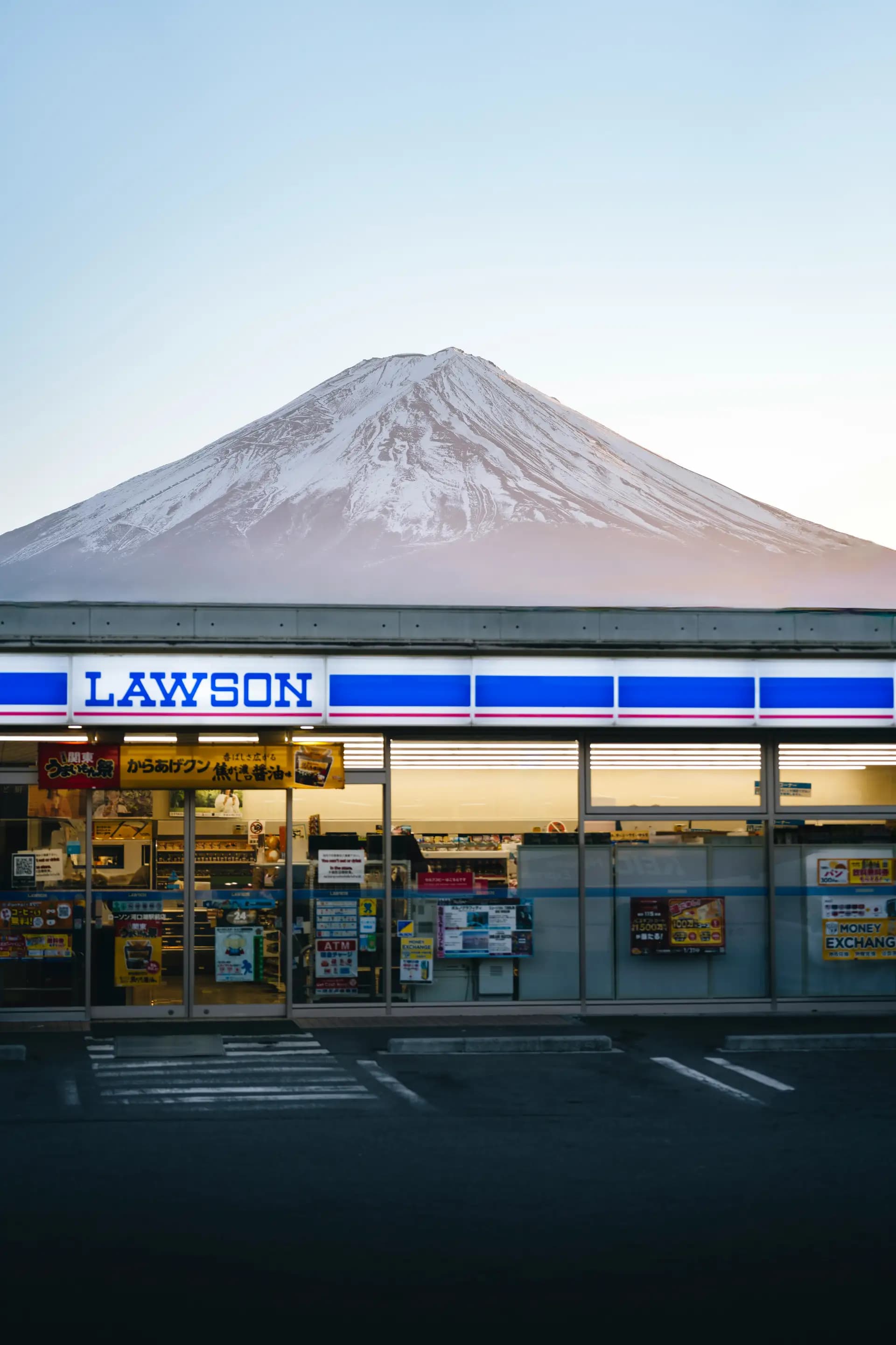 Mount Fuji rising behind a Lawson convenience store in Japan